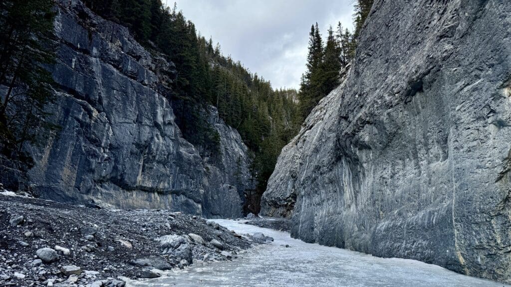 An icewalk in the middle between valley along the way to Grotto Canyon Icefalls, one of the best hikes in Kananaskis