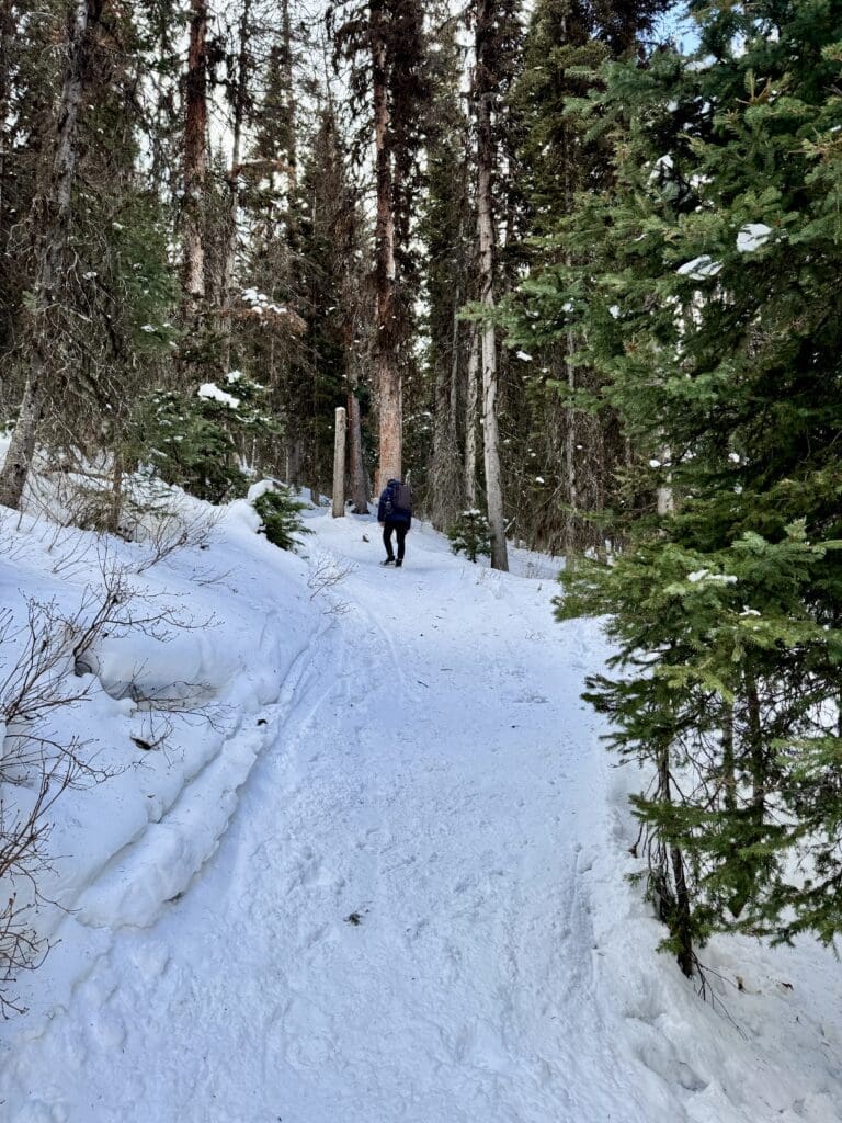 Hiking up the Rawson Lake Trail Kananaskis with packed snow
