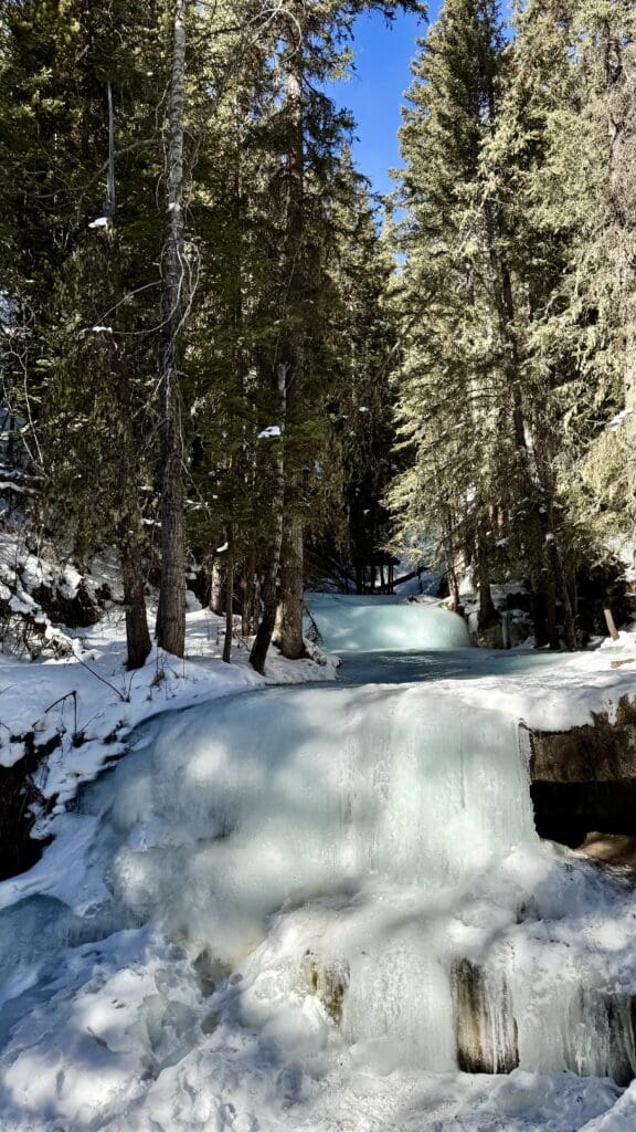 A sign stating end of trail of Troll Falls Kananaskis