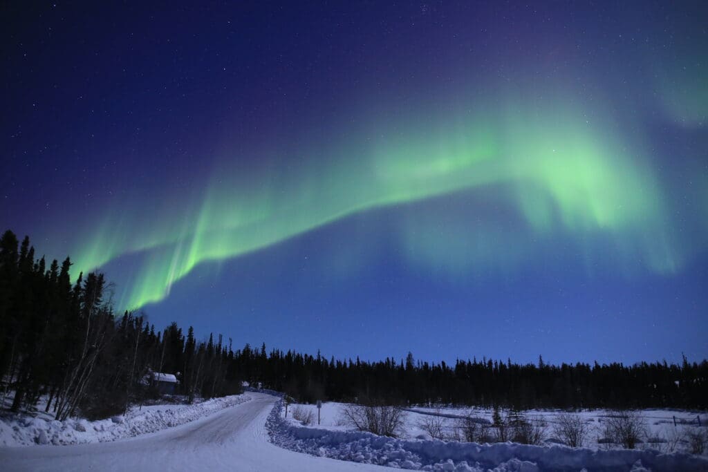 Aurora in Prelude Lake, a popular aurora viewing location close to Yellowknife
