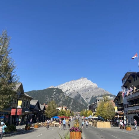 Banff Avenue in Banff National Park with not a single cloud in the sky