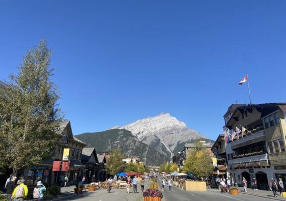 Banff Avenue in Banff National Park with not a single cloud in the sky