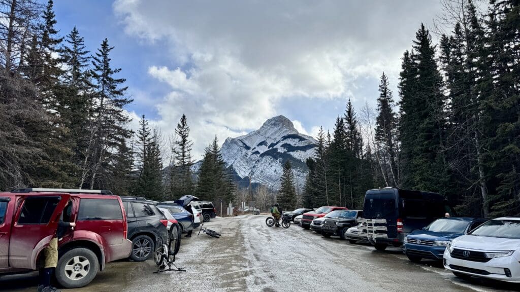 Many cars already parked at Grotto Canyon Trail Parking Lot in Kananaskis Country even in winter