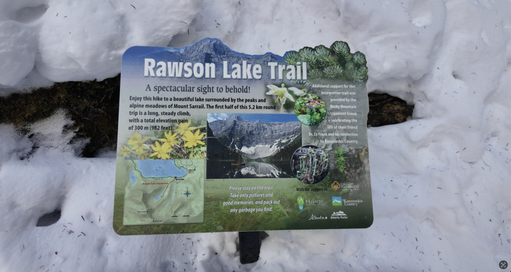A sign introducing Rawson Lake Trail in Kananaskis Country, describing the trail and showing the map