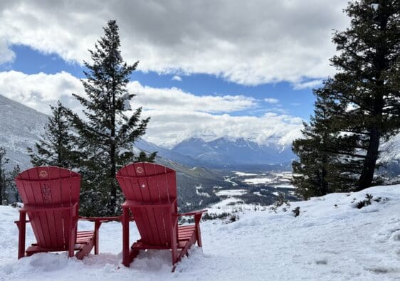 A pair of red chair placed by Parks Canada for being a scenic spot on Tunnel Mountain Summit in Banff National Park
