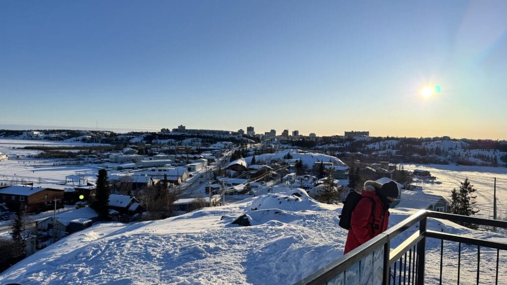 A scenic spot showing Old Town Yellowknife and Yellowknife Town on top of Bush Pilots Monument in winter with heavy snow covered