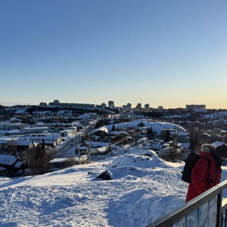 A scenic spot showing Old Town Yellowknife and Yellowknife Town on top of Bush Pilots Monument in winter with heavy snow covered