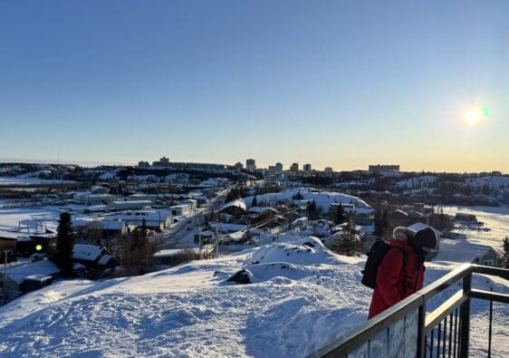 A scenic spot showing Old Town Yellowknife and Yellowknife Town on top of Bush Pilots Monument in winter with heavy snow covered