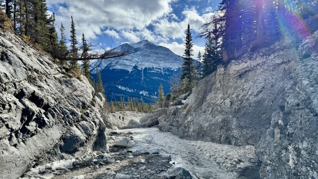 Sunny day with nice sunshine at the beginning of the Grotto Canyon Icewalk, one of the best hikes in Kananaskis