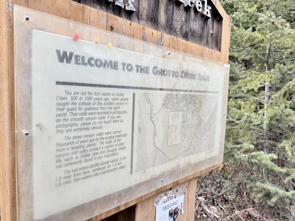 A board located at the trailhead talking about the history of Grotto Creek Trail