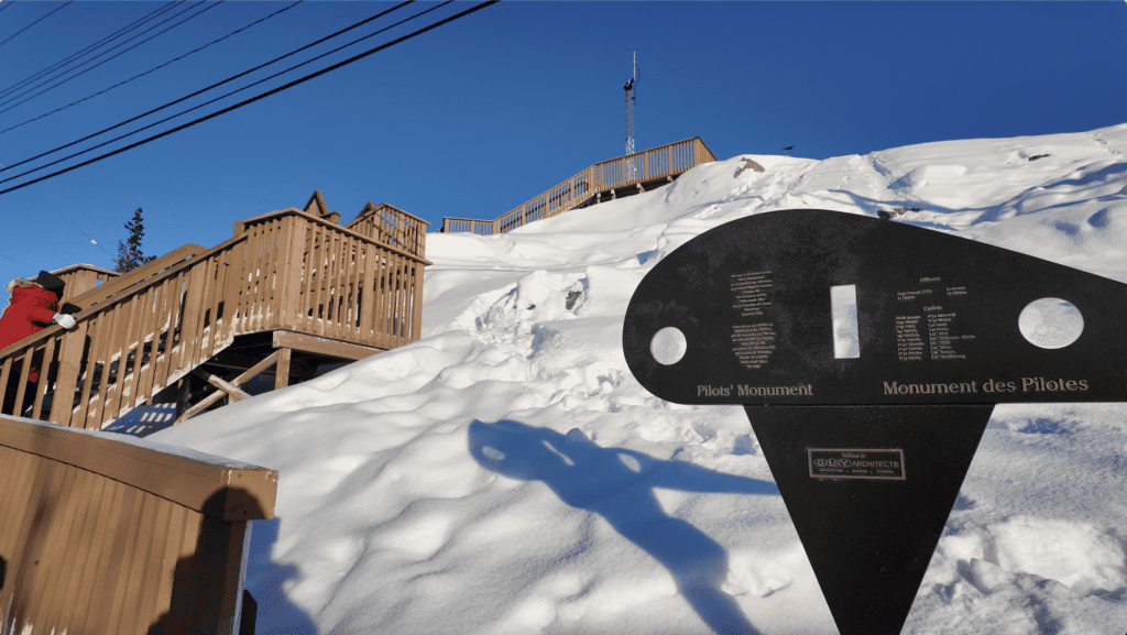The Bush Pilots Monument sign in Yellowknife and the wooden stairs heading up to the Monument