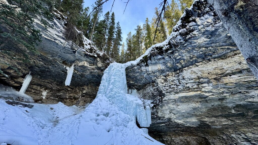 Frozen Troll Falls, one of the best hikes in Kananaskis, with a huge icefall in the middle of limestone