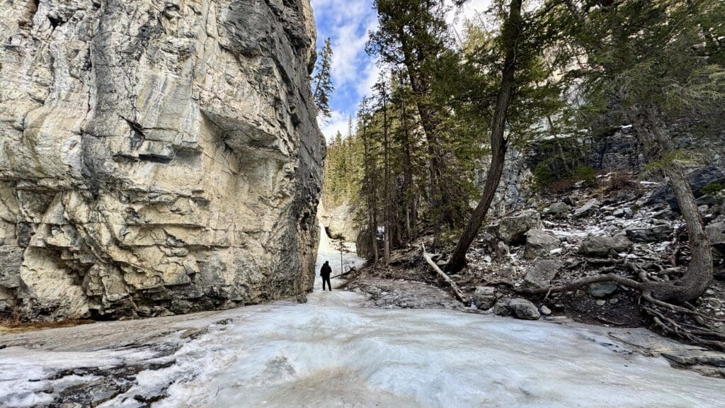 Trying to walk the steeper icewalk to reach the larger icefall on the right of Grotto Canyon Icefall in Kananaskis Country